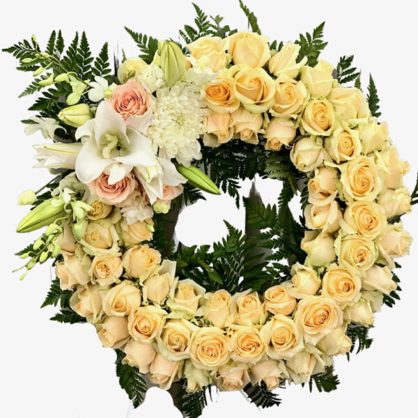 Roses with Lilies Highlight Round Funeral Wreath